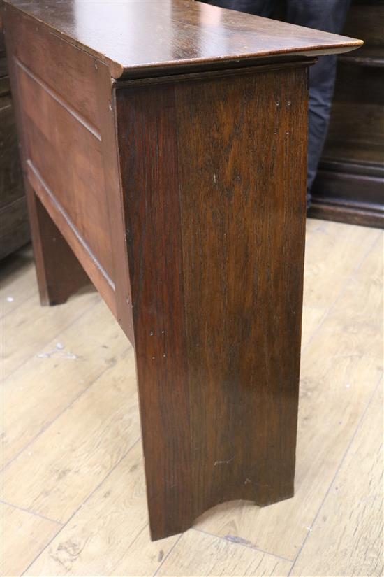 An early 20th century Arts & Crafts oak two door cupboard W.101cm